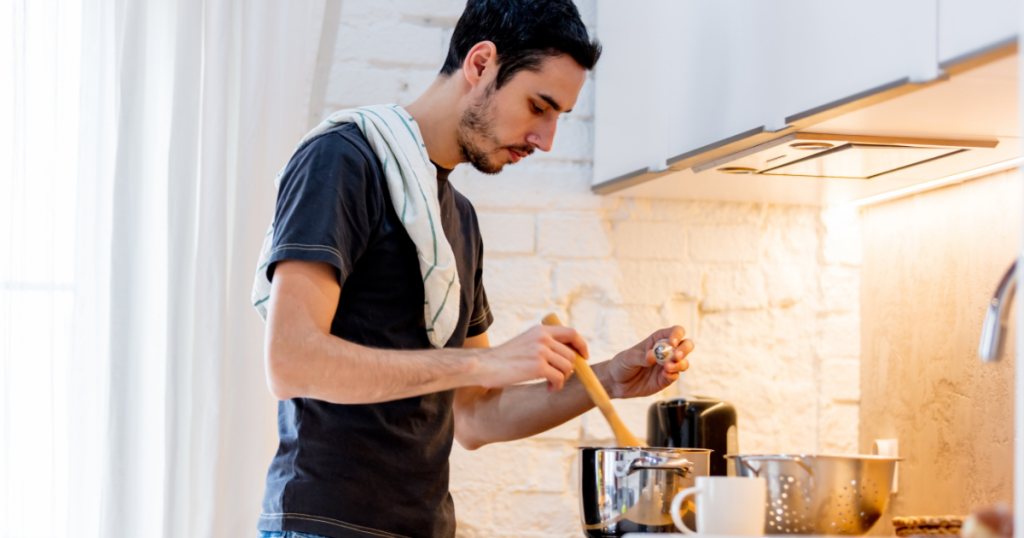 man cooking in the kitchent