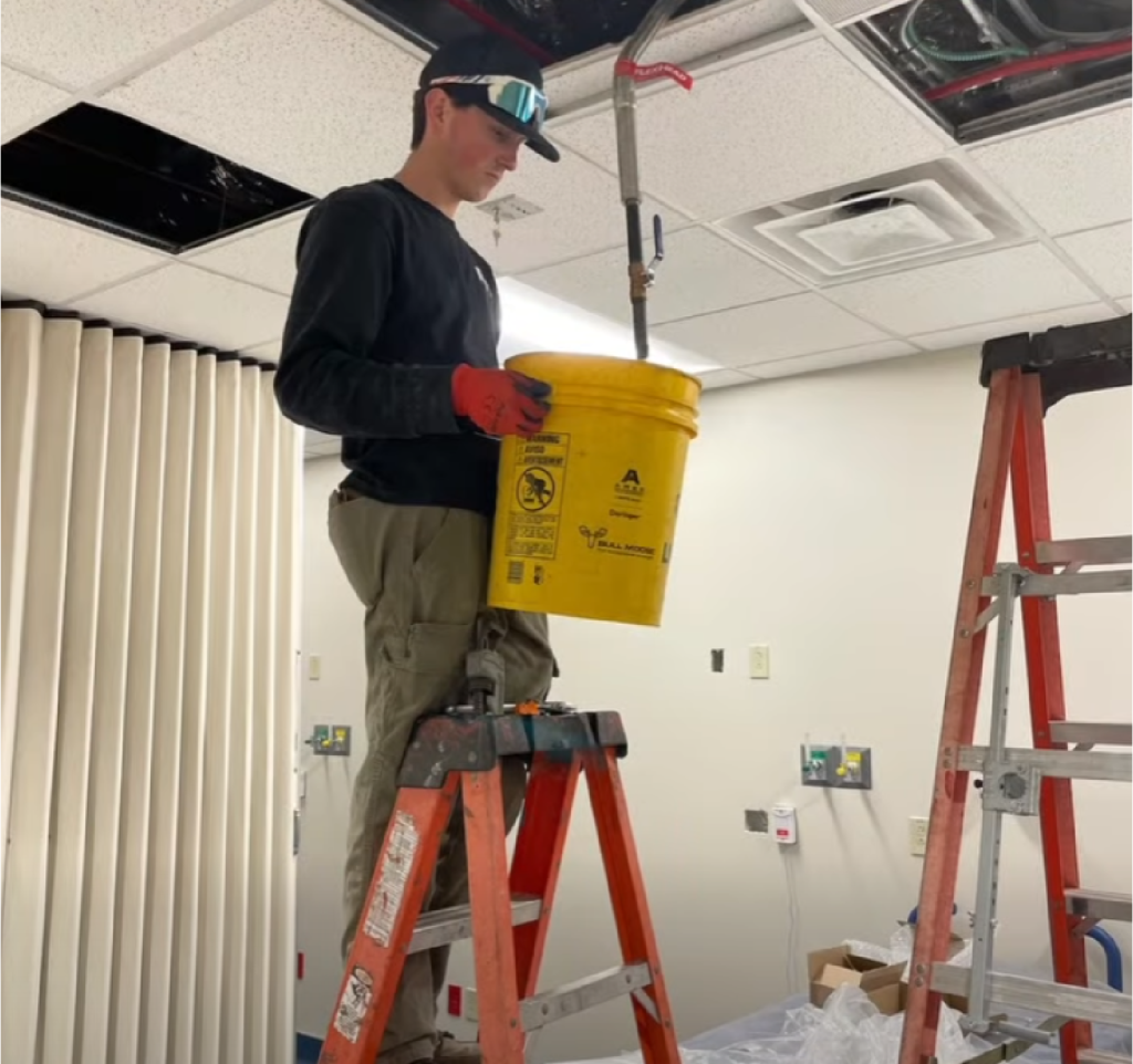 B&W Worker holding bucket